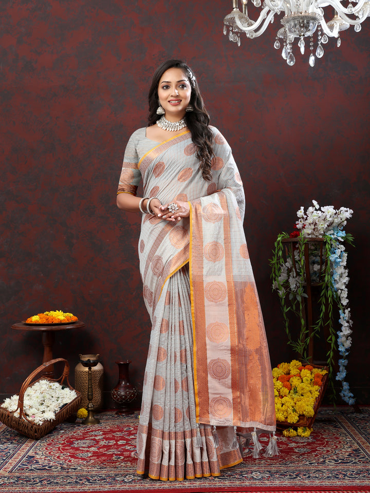 Stylish grey cotton saree featuring intricate zari details, perfect for traditional celebrations.