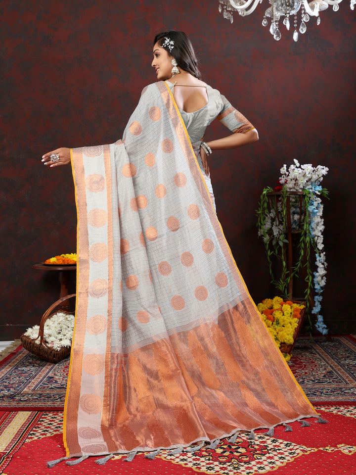 Pink cotton saree with intricate zari woven designs, perfect for weddings and cultural events.