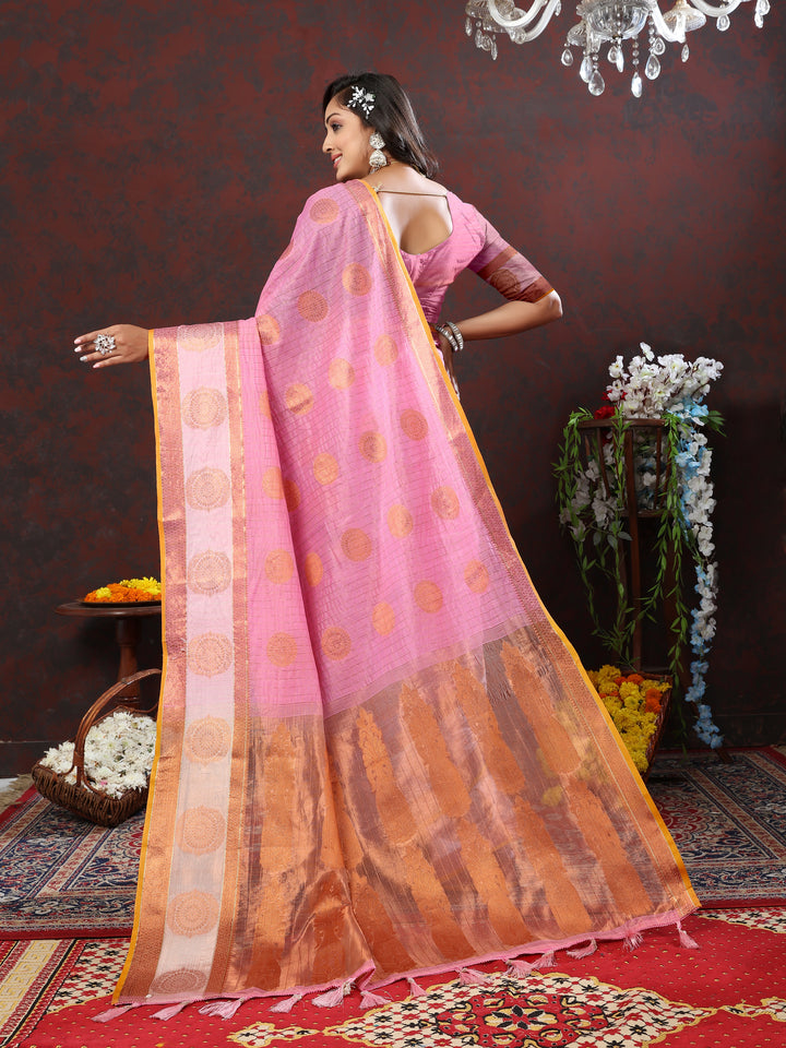 Elegant orange saree with luxurious zari detailing, ideal for cultural and festive gatherings.