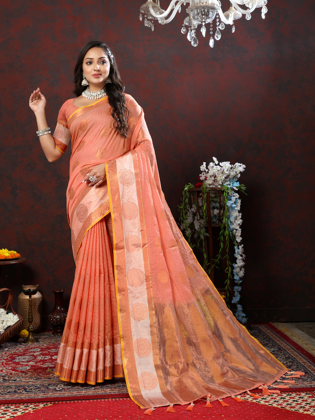 Elegant orange saree with detailed zari woven work, perfect for traditional occasions.