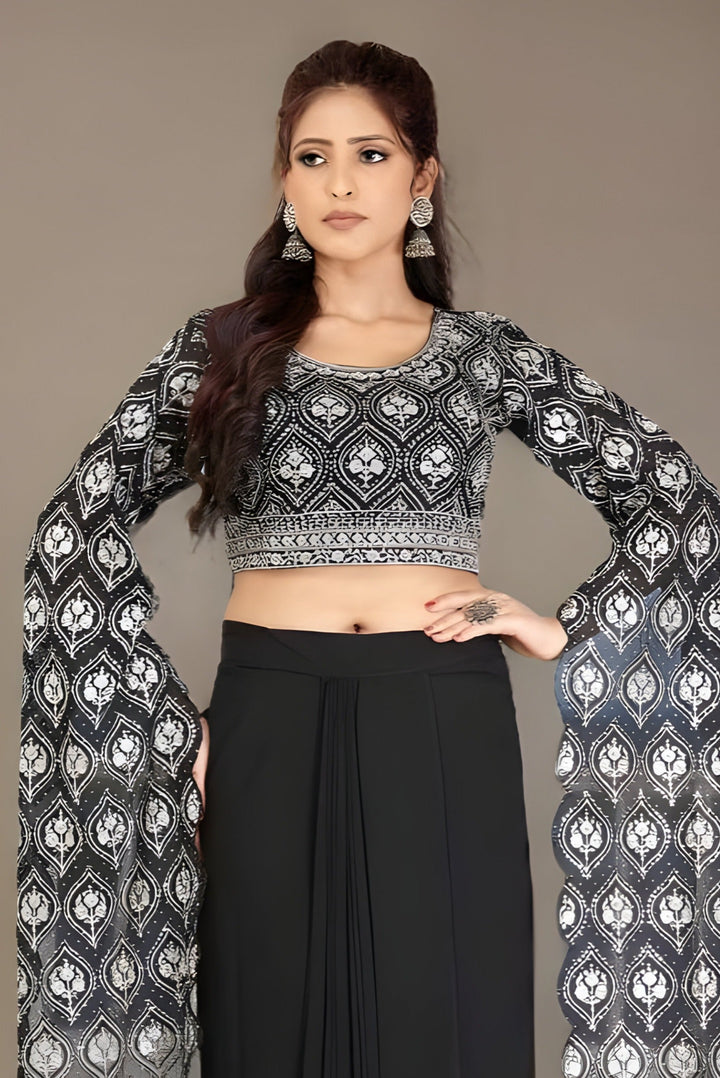 Chic black lehenga with a floral crop top, ideal for parties and celebrations.