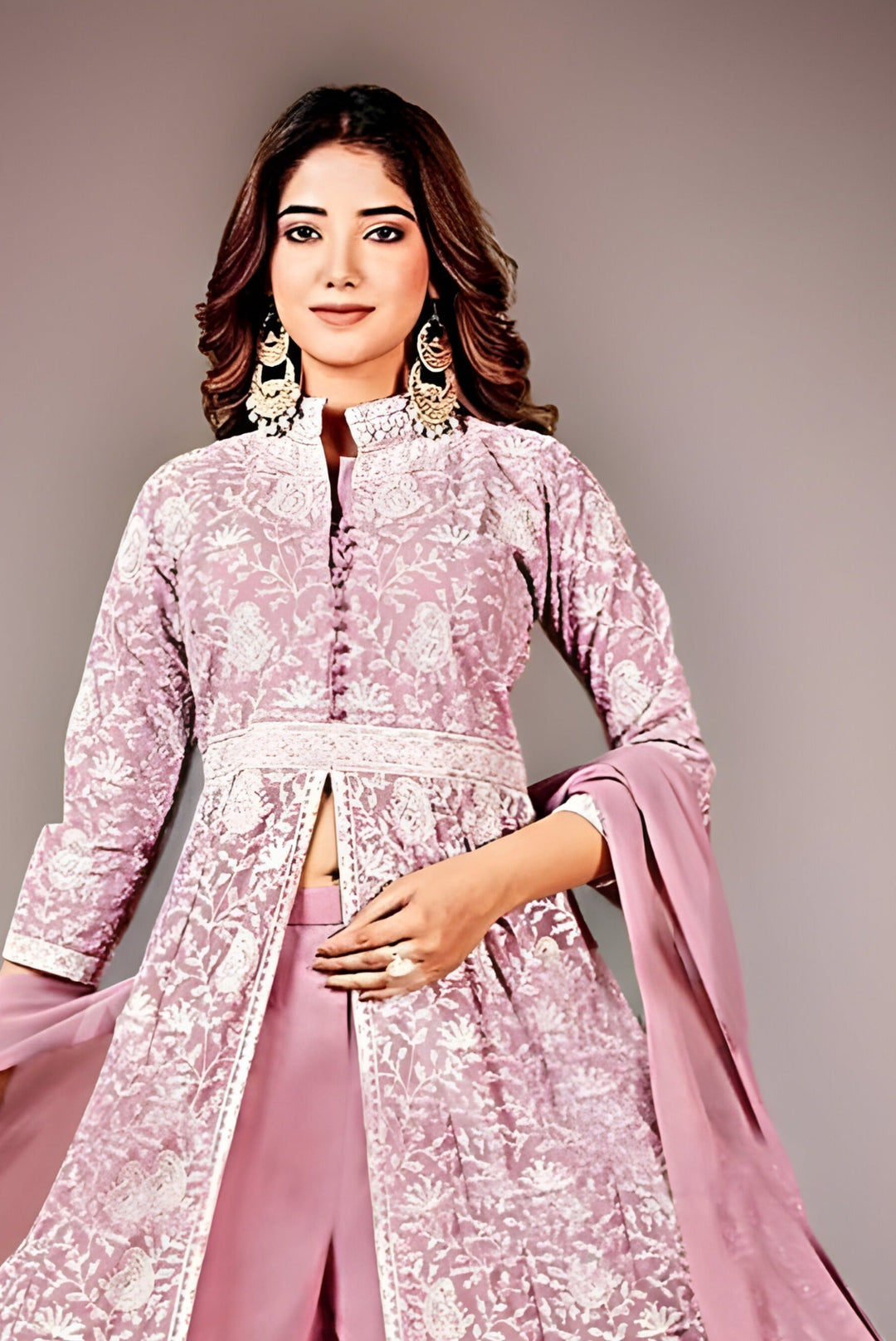 Stunning pink lehenga featuring a stylish peplum top, ideal for weddings and celebrations.