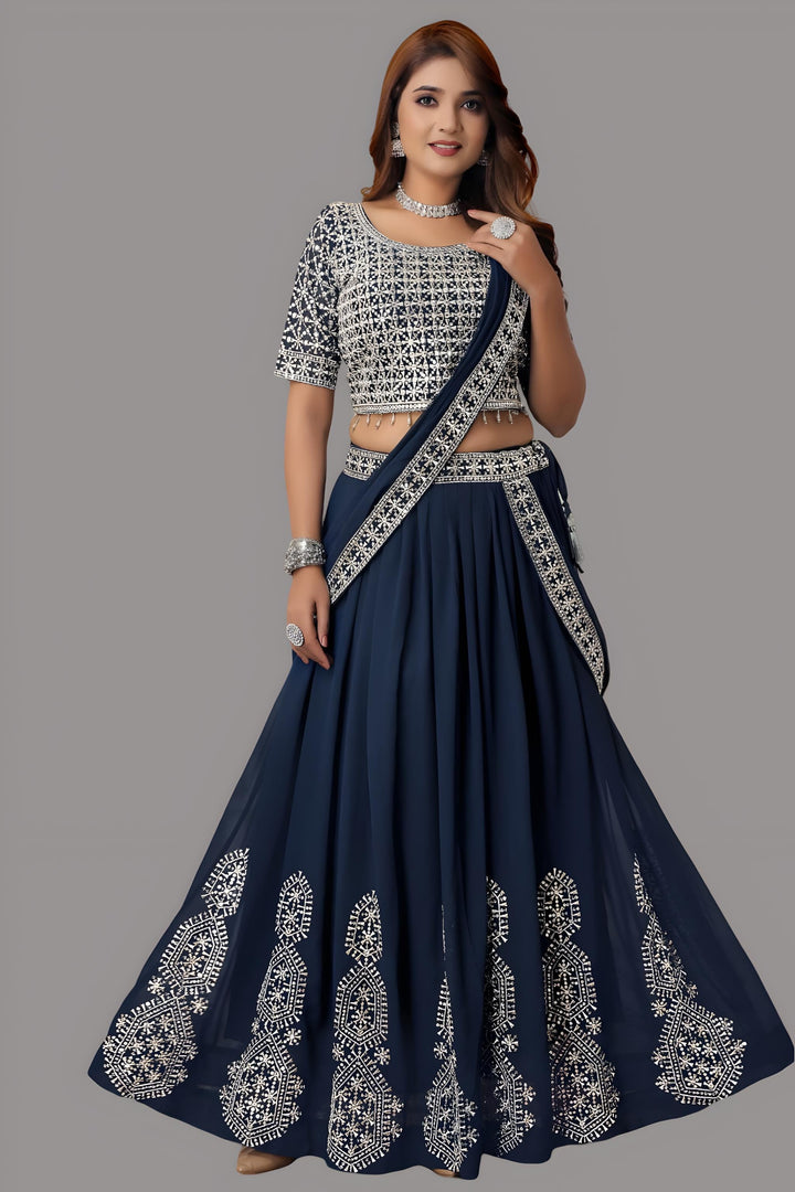 Stylish blue floral crop top and skirt lehenga set made from georgette fabric, ideal for festive occasions.