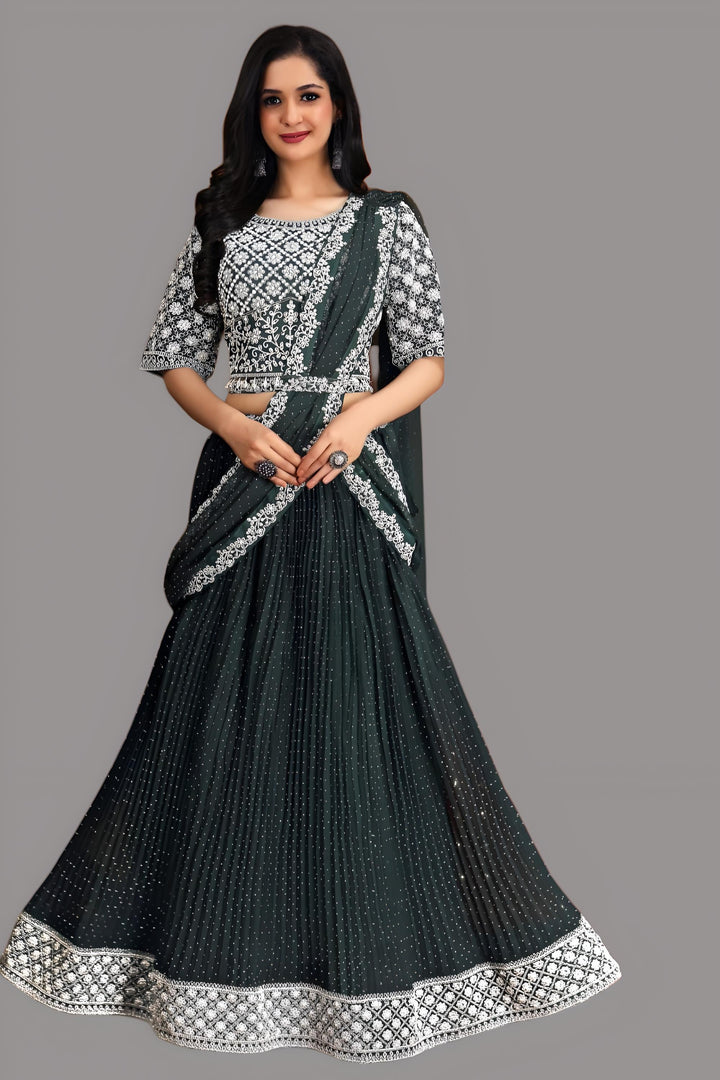 Dark green buttercup draped georgette saree featuring hand-painted floral designs, ideal for elegant occasions.