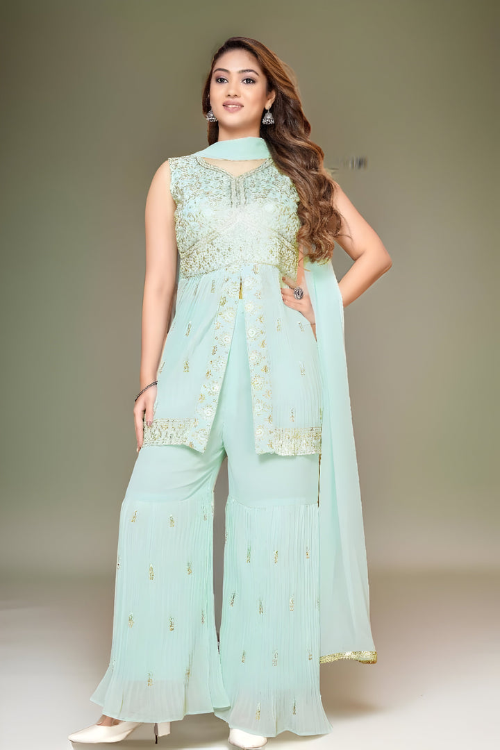 Mint green garara suit featuring a vibrant kurti and matching dupatta, perfect for festive occasions.