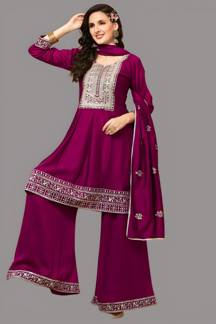 Elegant maroon garara suit featuring a silk kurti and dupatta, perfect for festive occasions.