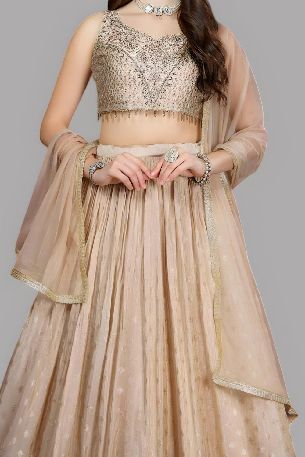 Elegant cream lehenga with a stylish floral crop top, designed for women.