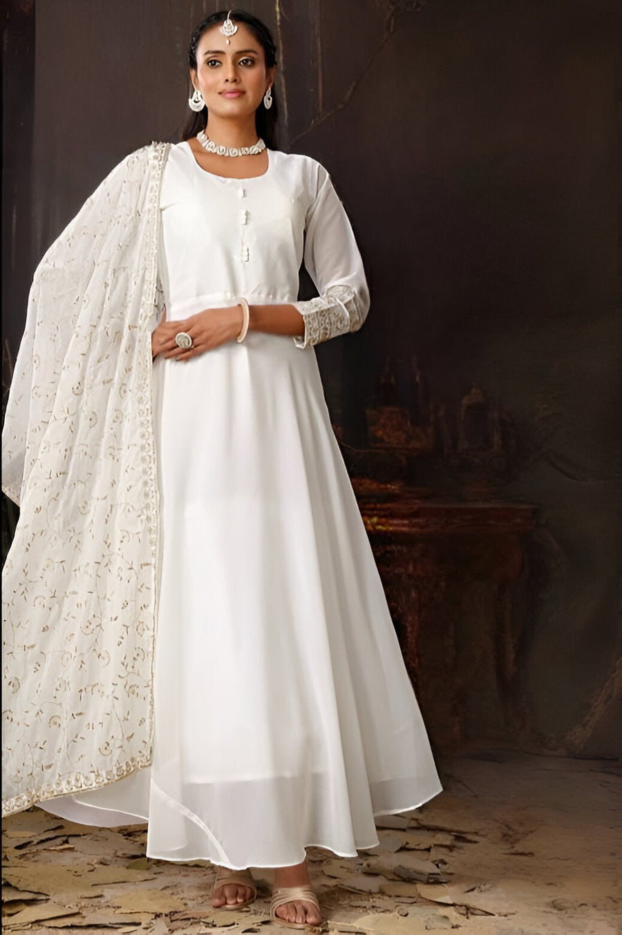 White georgette gown dress featuring an elegant pleated design and front slit, perfect for special occasions.