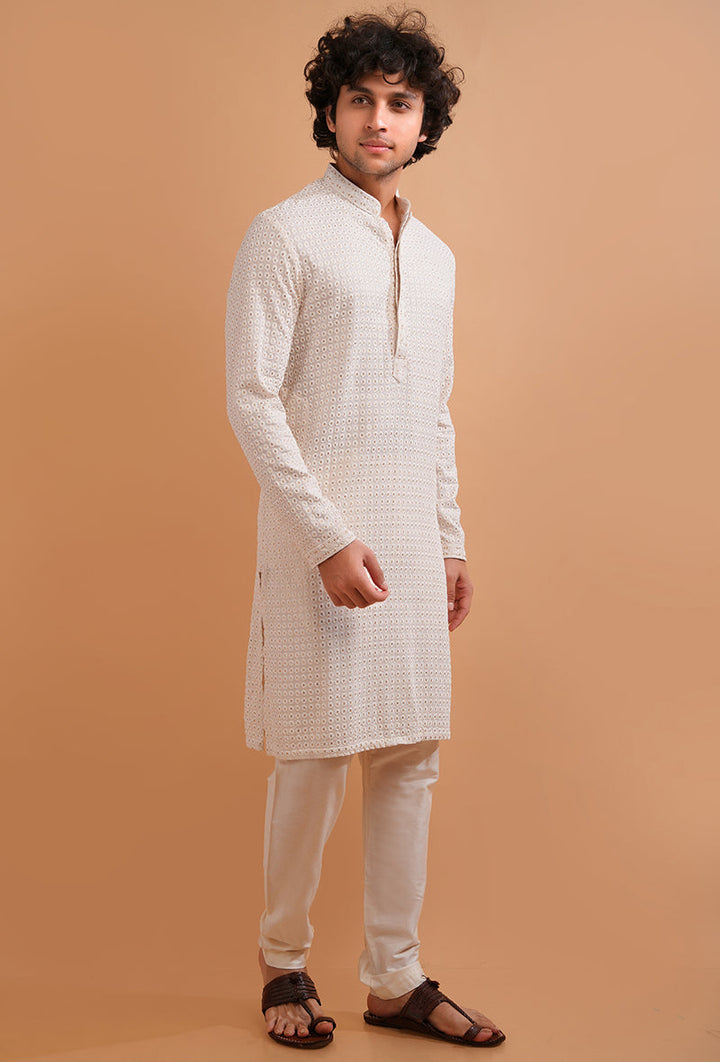 Men’s embroidered cream silk kurta pajama set, ideal for cultural and festive celebrations.