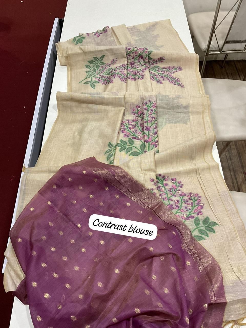 Muga cotton saree with floral weave, small zari border, and contrast blouse piece