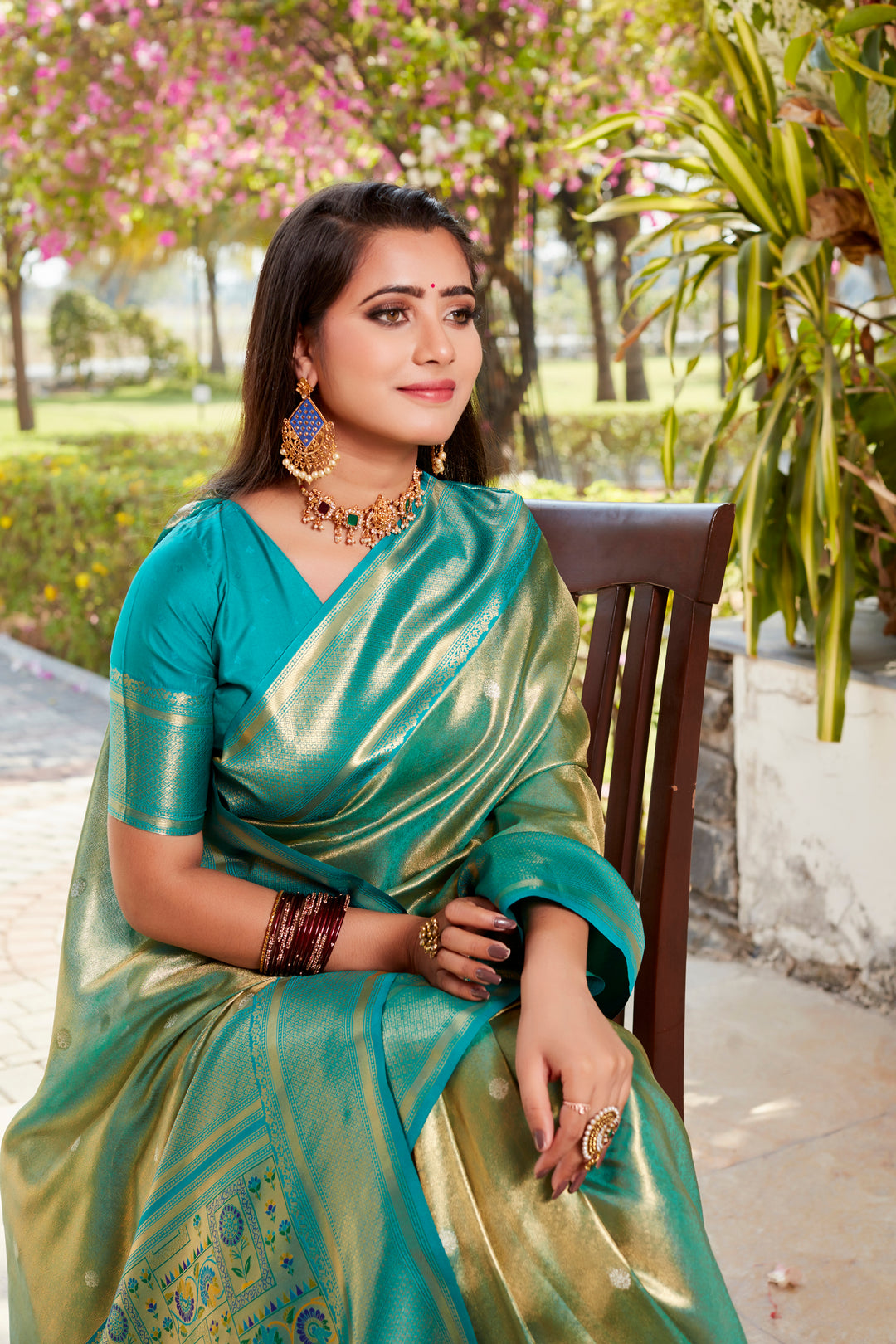 Beautiful green tissue silk saree with rich pallu and contrast blouse, perfect for festive occasions.