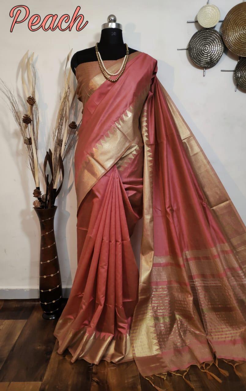 Chic peach fancy saree with a temple zari border and matching blouse piece, a must-have for Indian wedding celebrations.