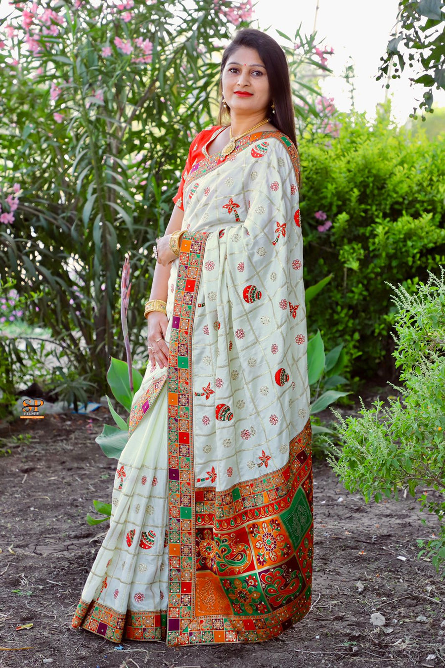 Elegant Dola Silk saree in white with intricate embroidery and diamond work, perfect for festive occasions.