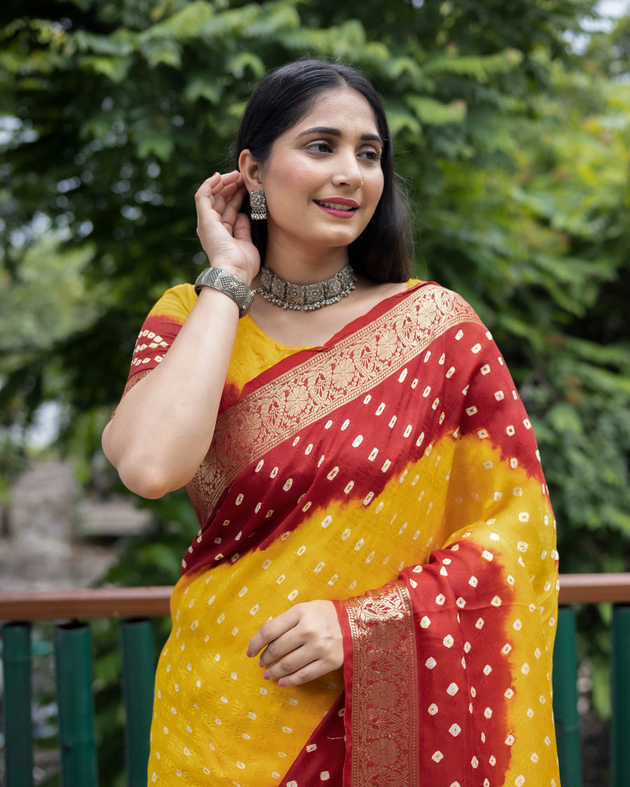 Elegant yellow Bandhej silk saree with intricate zari work and matching blouse, perfect for festive occasions.