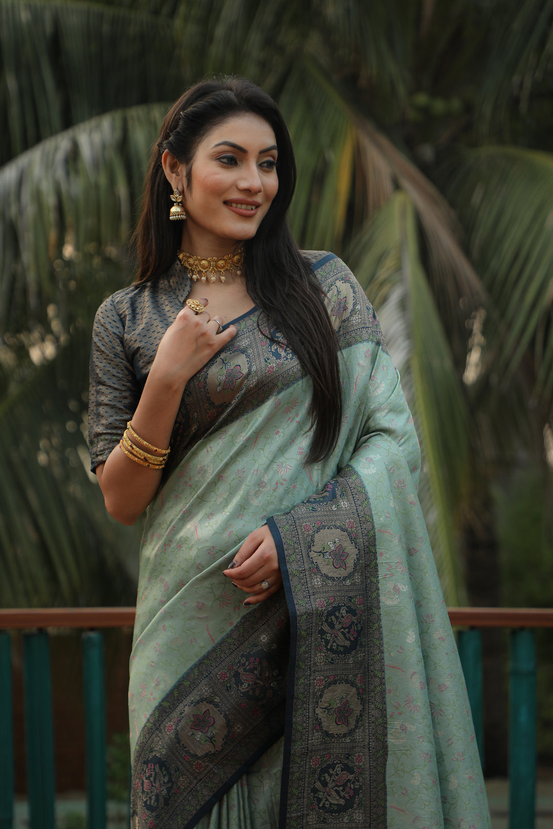 Elegant green Kanjivaram silk saree with intricate weaving and a radiant finish, perfect for weddings and festivals.