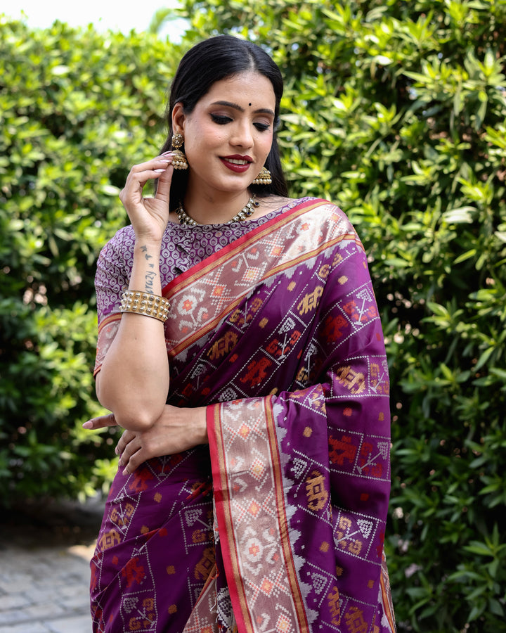 Gorgeous purple Bandhej silk saree with intricate zari woven pallu and matching blouse, ideal for weddings.