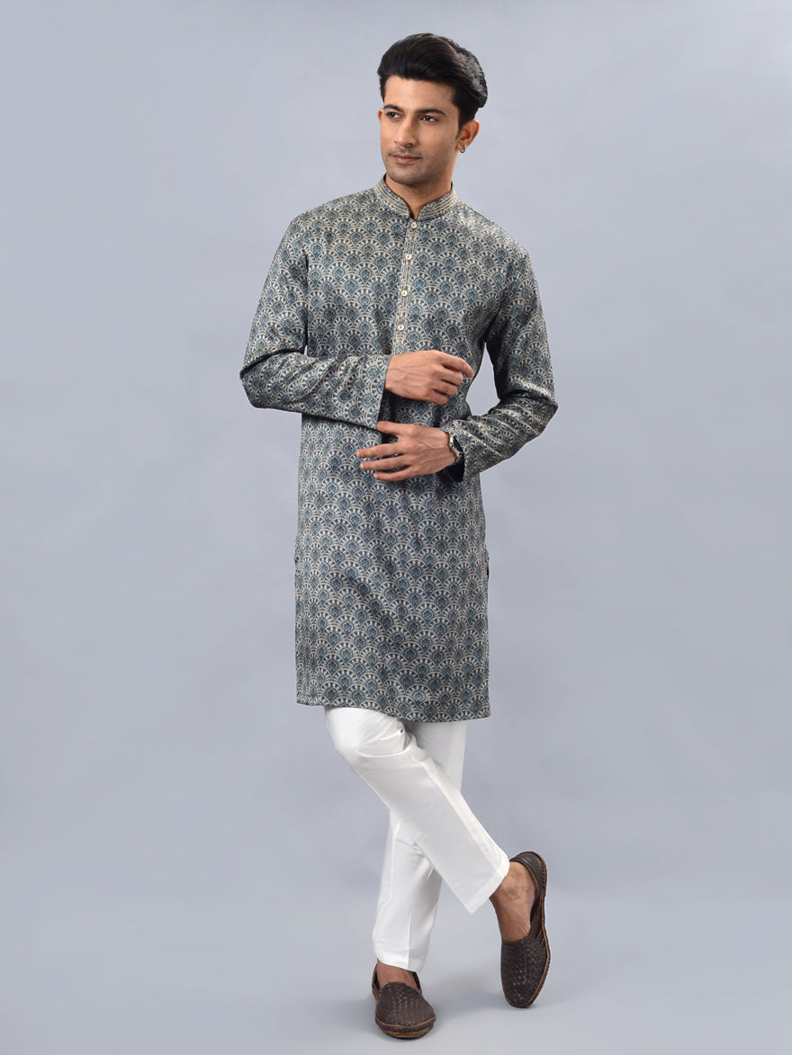 Premium green kurta pajama set for men, ideal for pooja and festive occasions.