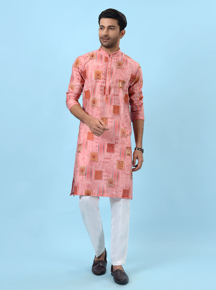 Traditional pink kurta pajama set for men, crafted from luxurious silk fabric.