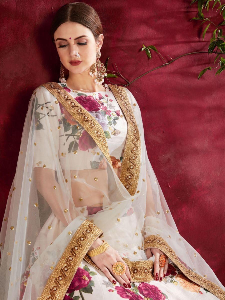 Elegant off-white lehenga choli with sequins and lace border work