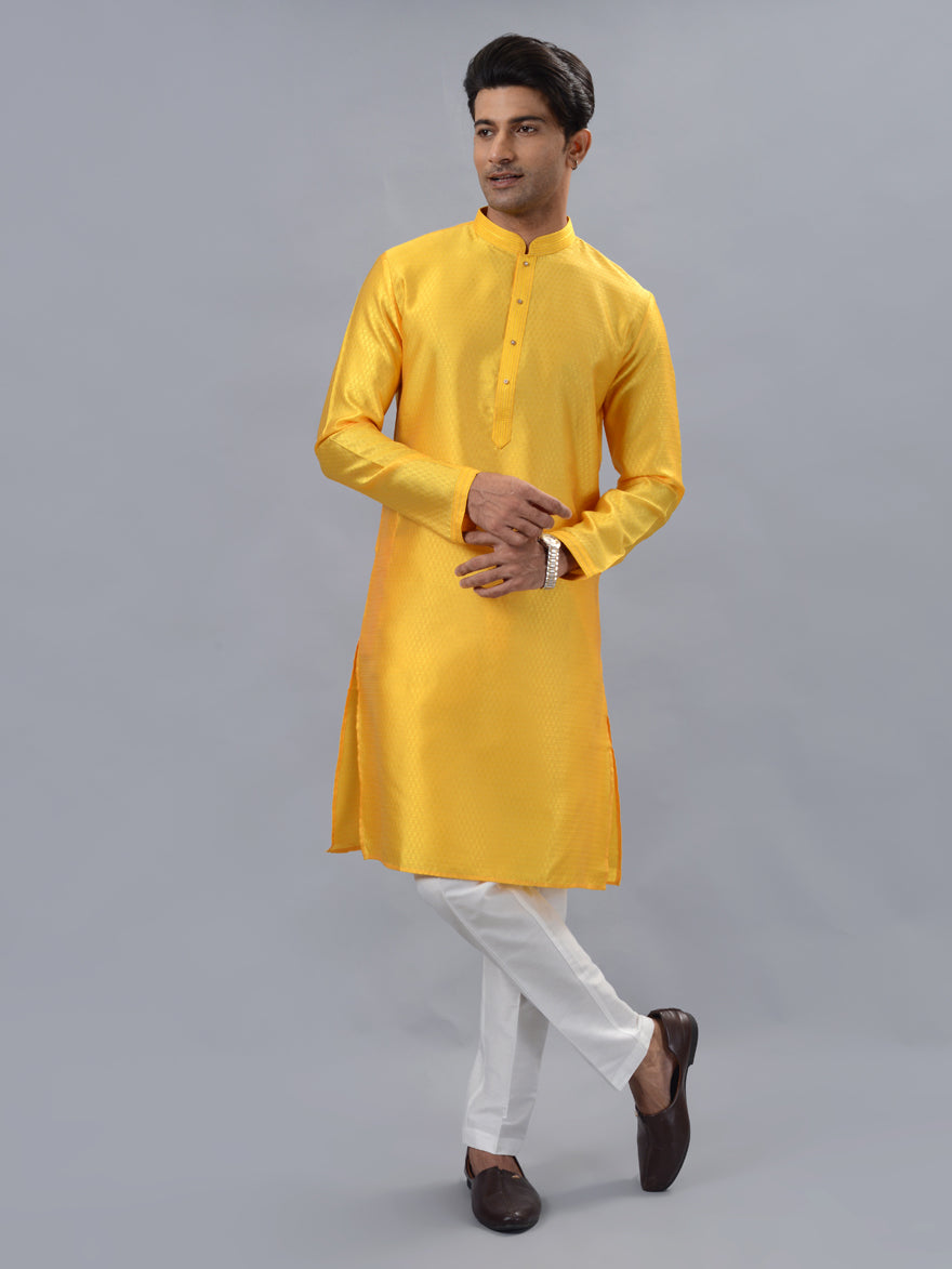 Elegant yellow silk kurta set for men, ideal for weddings and festive celebrations.