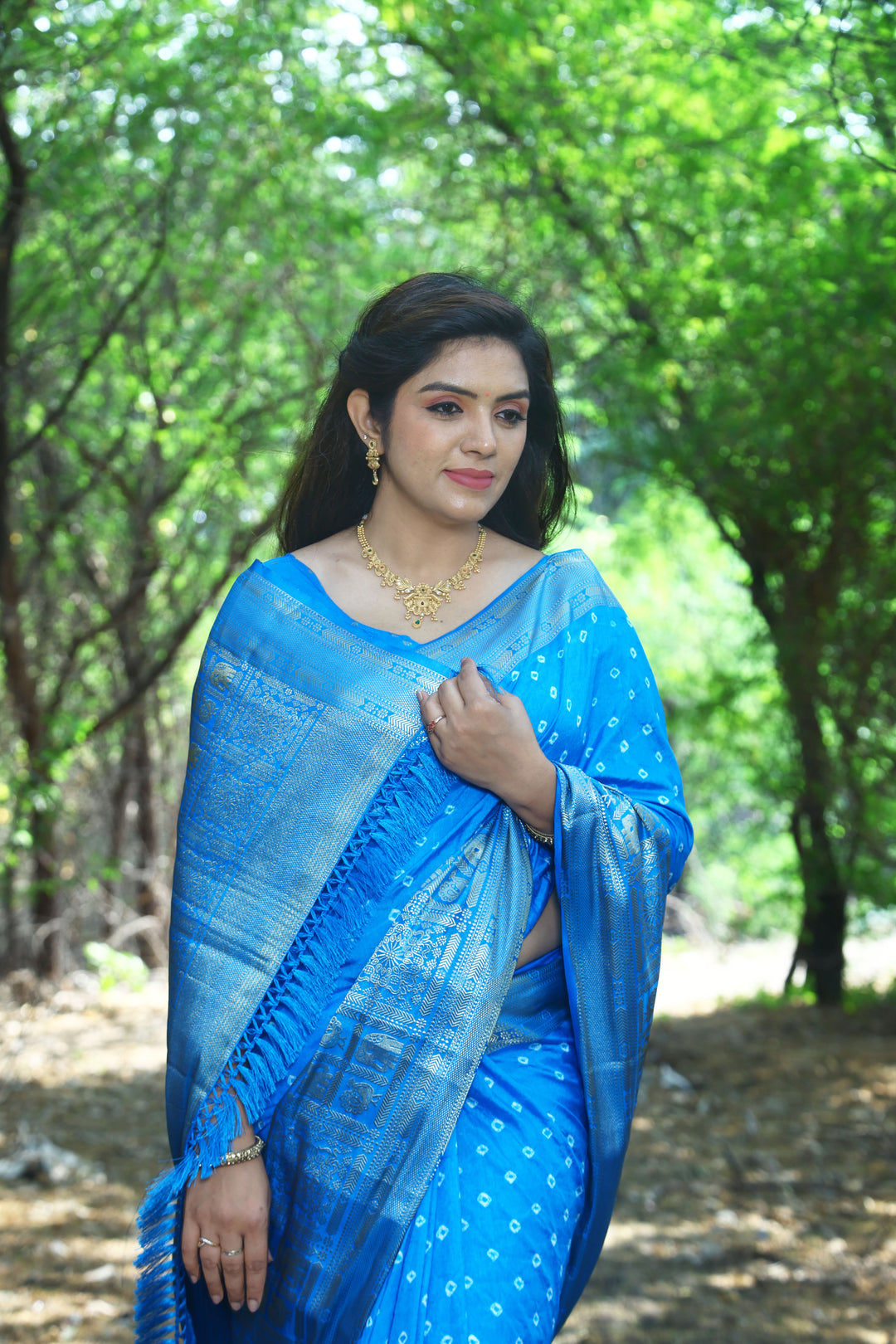 Elegant blue handmade Bandhej Kanjivaram silk saree with stunning border and pallu, ideal for weddings.