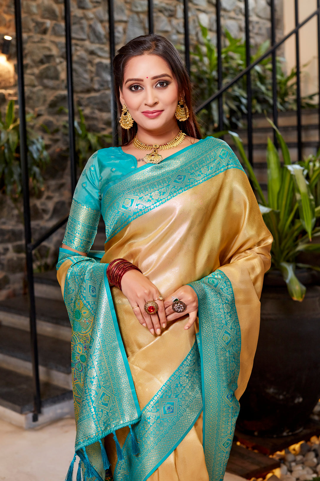 Elegant golden Tissue silk saree with beautiful contrast border, perfect for weddings.