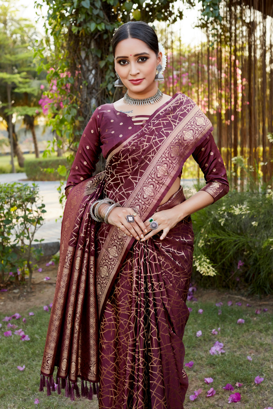 Elegant wine Kanjivaram soft satin silk saree with intricate butta work, perfect for weddings and festive occasions.