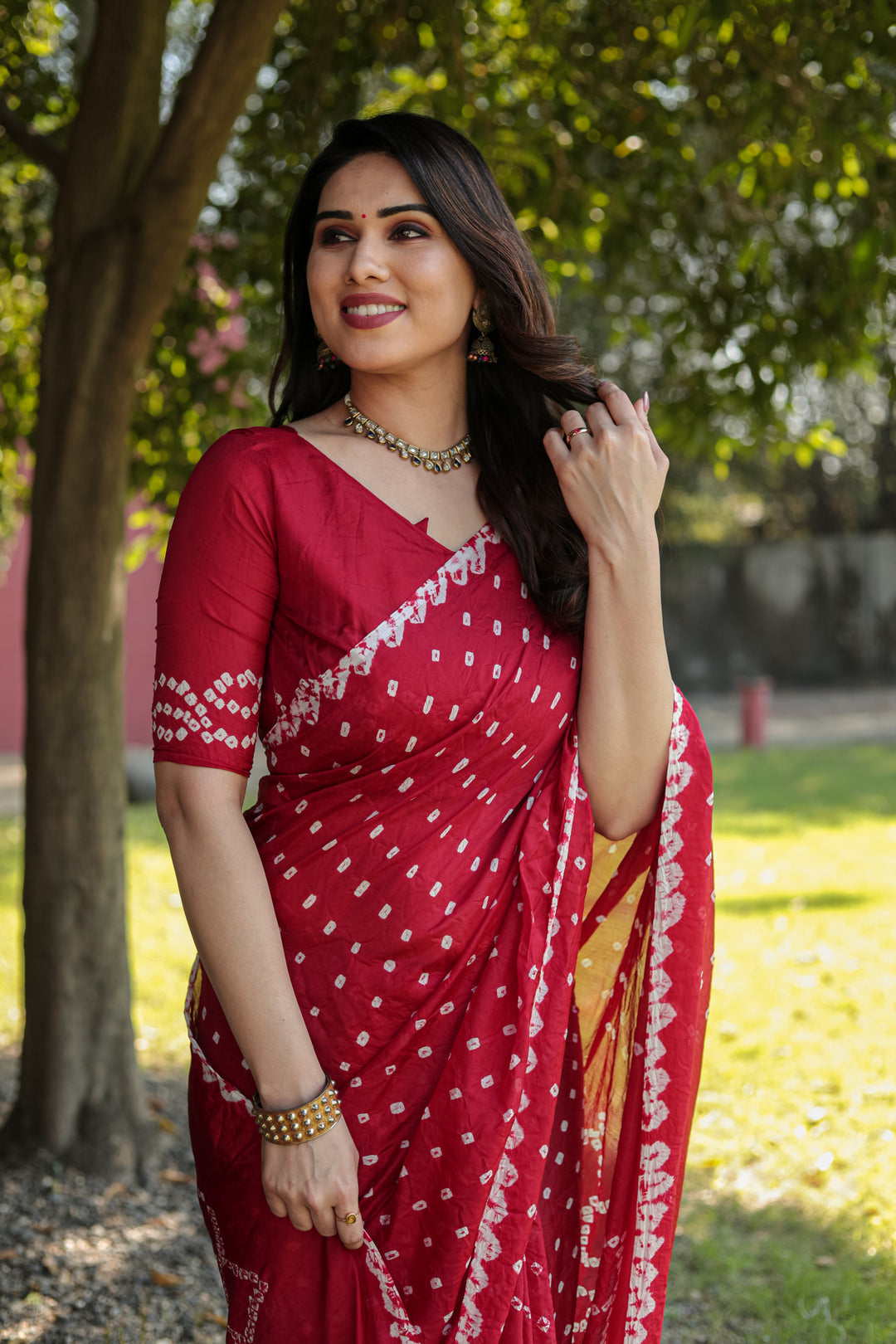 Premium Red Bandhej Silk Saree with exquisite Zari weaving and designer Pallu for weddings and celebrations.