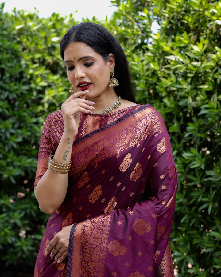 Elegant purple soft silk saree with intricate weaving, finished with a regal pallu and brocade blouse.