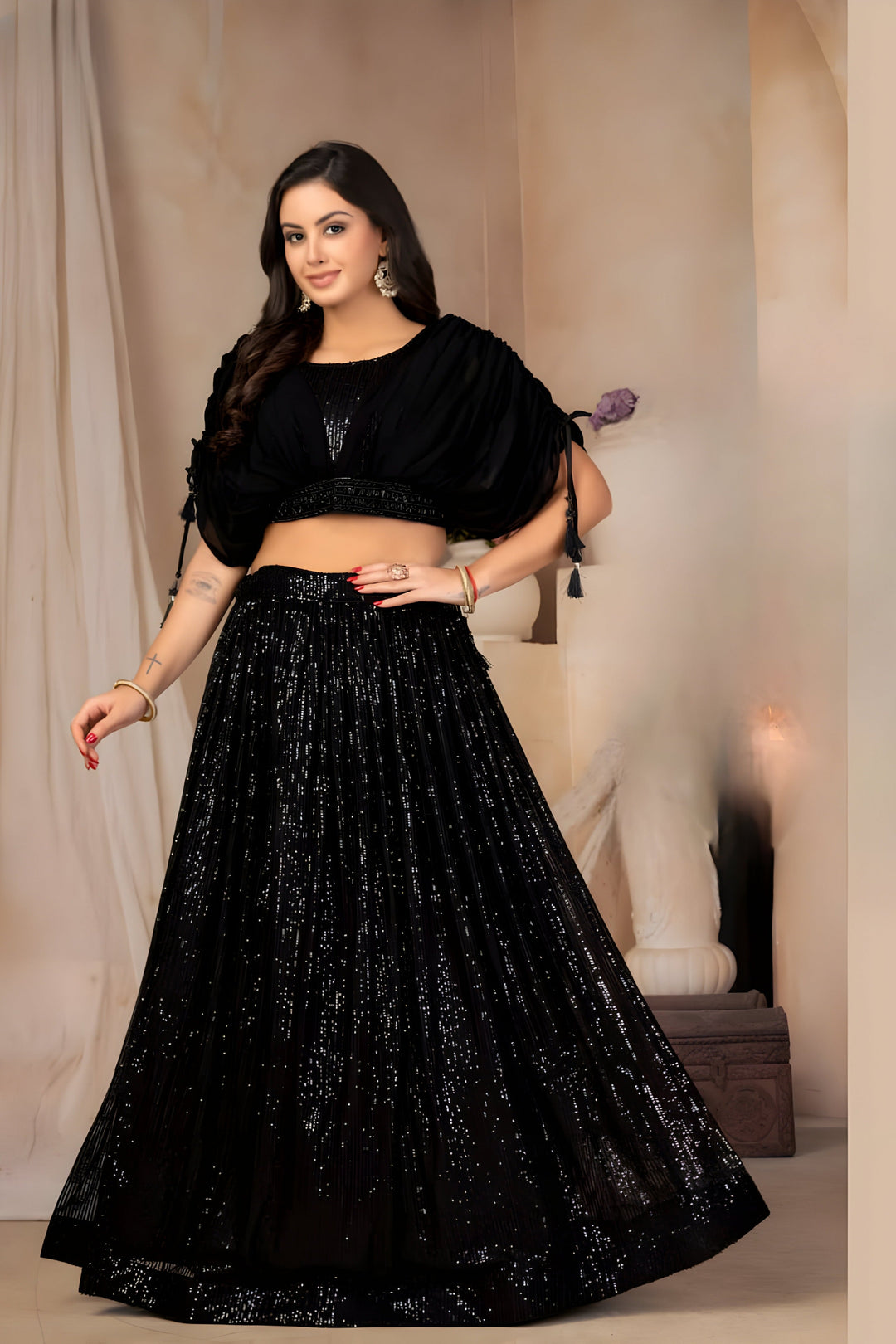 Designer black floral crop top paired with a lehenga set made from georgette fabric.