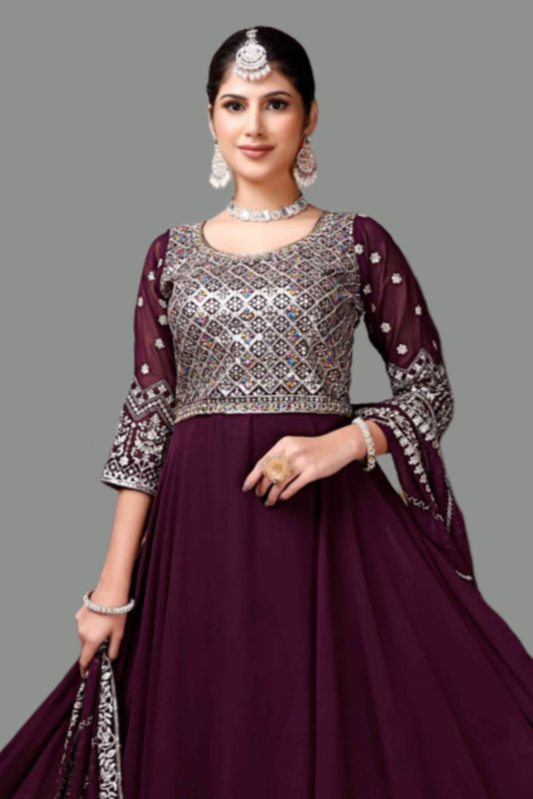 Stunning purple gown featuring a chic design, perfect for women’s formal wear.