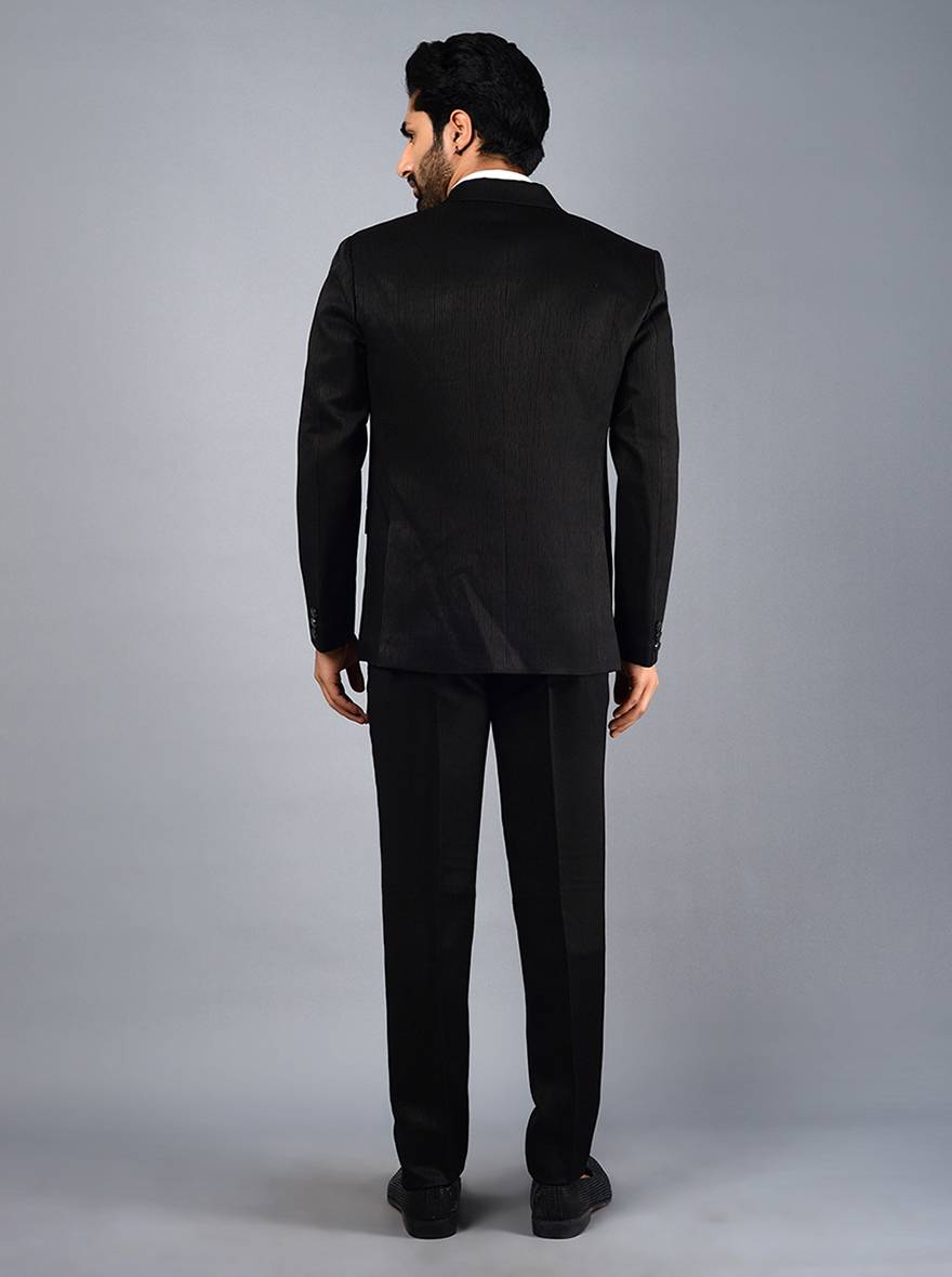 Stylish black suit for men with detailed self-embroidery and jacquard fabric, perfect for formal events and weddings.