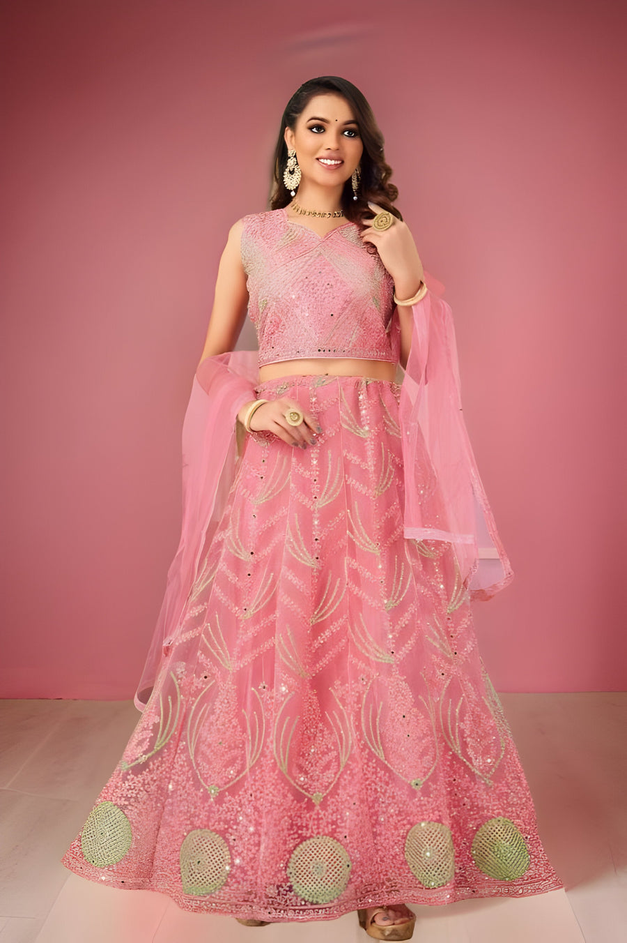 Pink net lehenga set, perfect for bridal events and parties with elegant design.