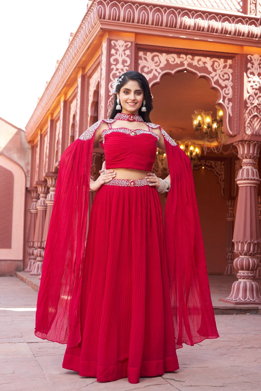 Red floral crop top skirt lehenga in georgette fabric, perfect for party wear with its vibrant design and comfort.