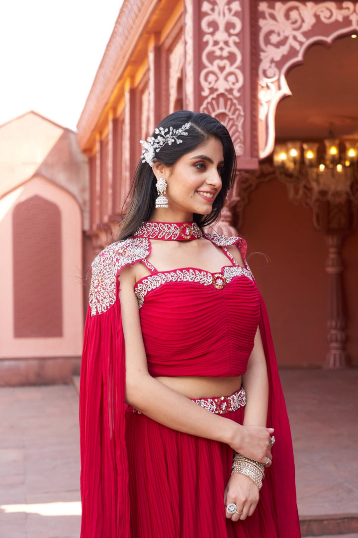 Elegant red floral crop top lehenga crafted from soft georgette, perfect for making a statement at parties.