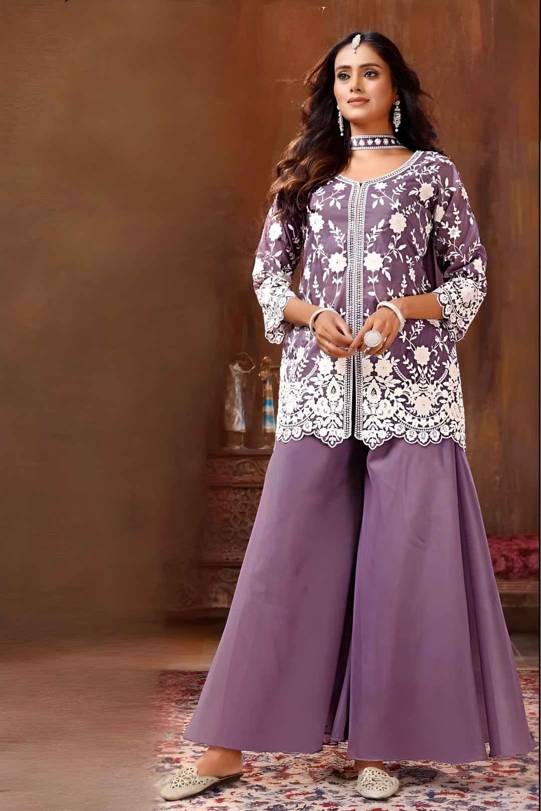 Elegant purple garara suit featuring a vibrant kurti and matching dupatta, perfect for festive occasions.