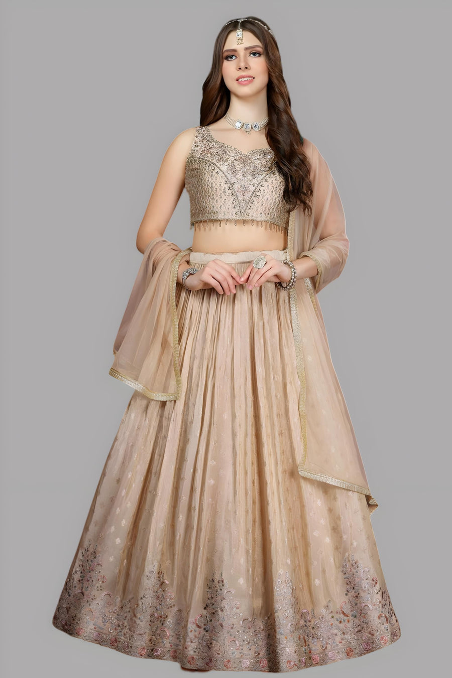 Cream floral crop top and skirt lehenga set made from silk fabric, ideal for celebrations.