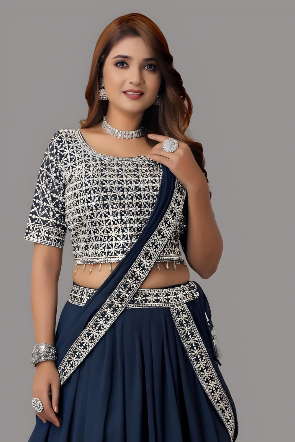 Chic blue lehenga with a floral crop top designed for women’s fashion.