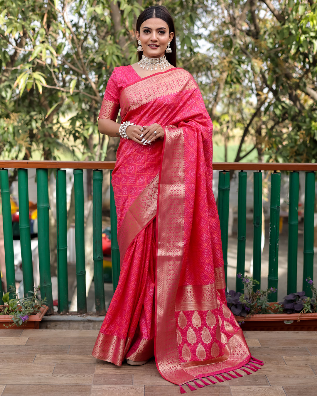 This fancy saree in bright pink showcases traditional craftsmanship and modern elegance for festive occasions.