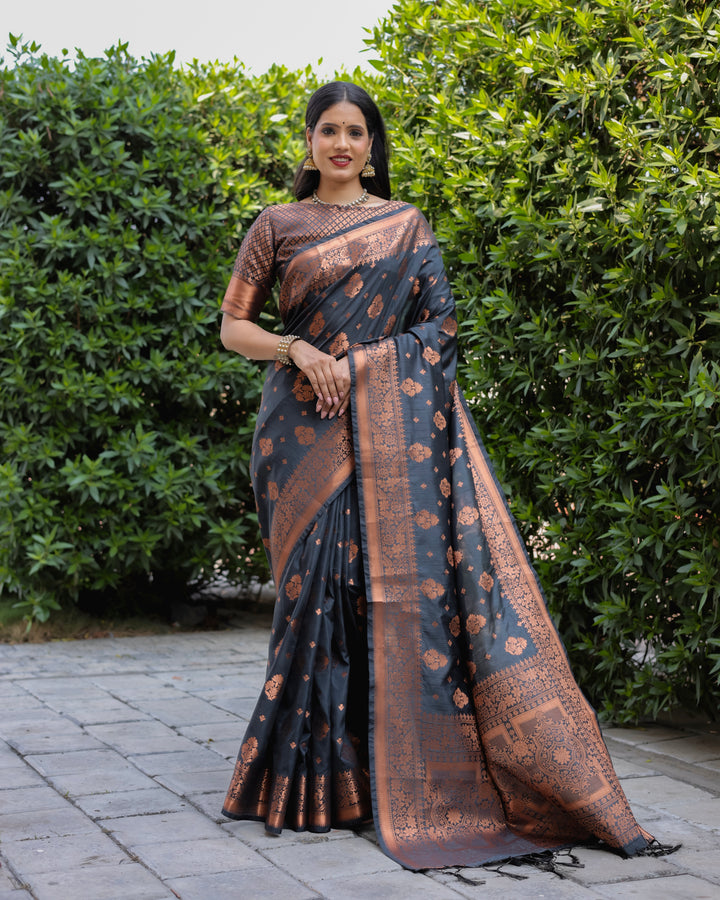 Black soft silk saree with copper body and contrast border, offering an elegant and luxurious look for any occasion.