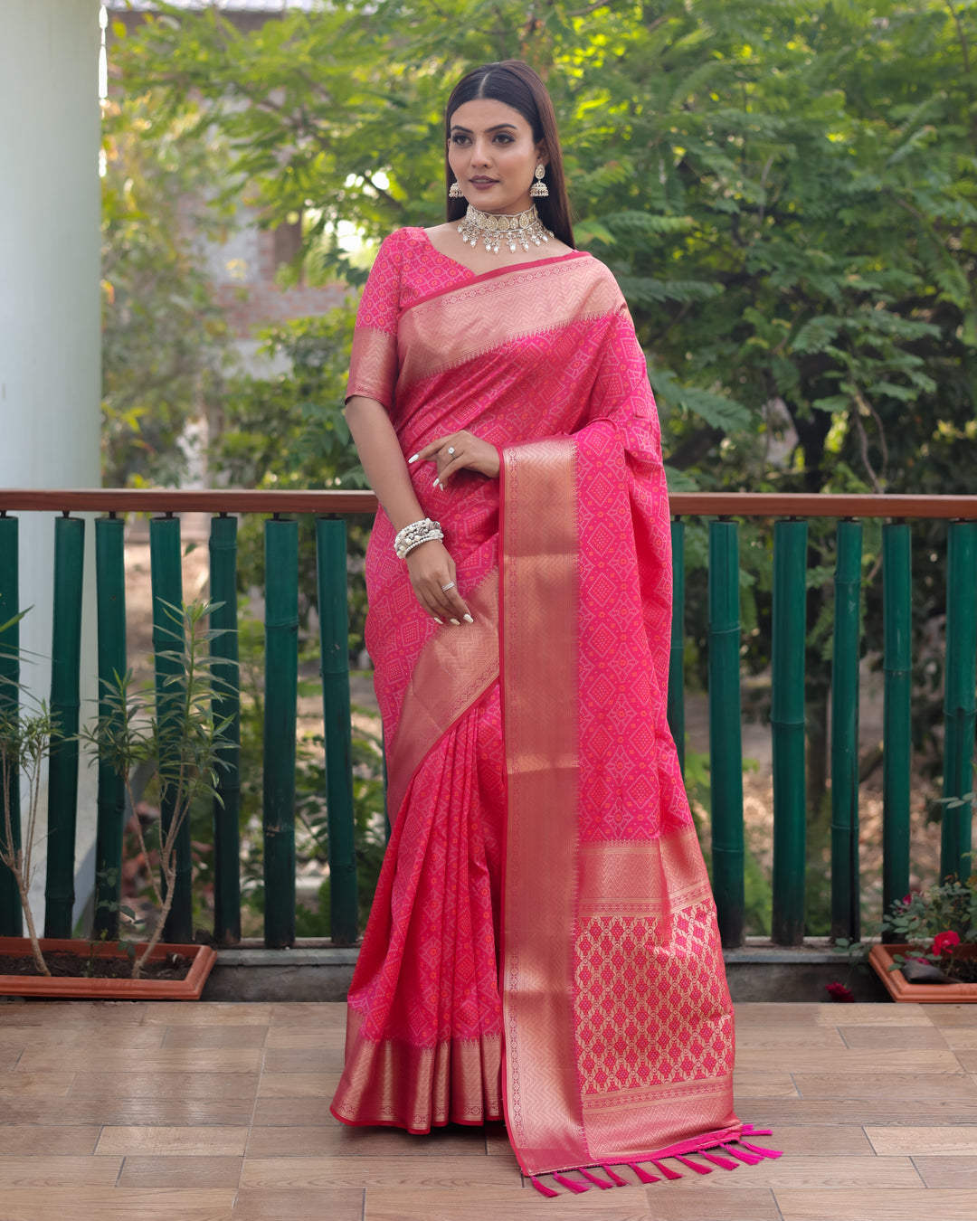 Traditional bright pink Bandhej silk saree reflecting India's heritage, perfect for cultural celebrations and festivities.