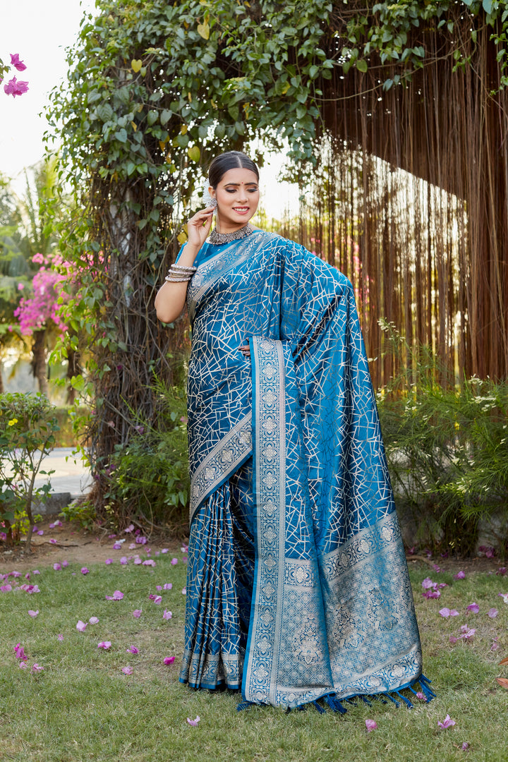 Stylish blue Kanjivaram soft satin silk saree with delicate butta design, ideal for festive and special occasions.