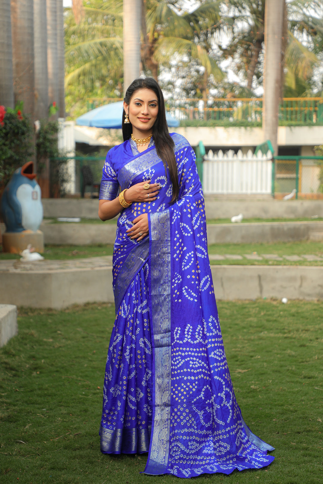 Royal blue Bandhej silk saree with a rich jari border and Bandhej pallu, perfect for festive and cultural occasions.