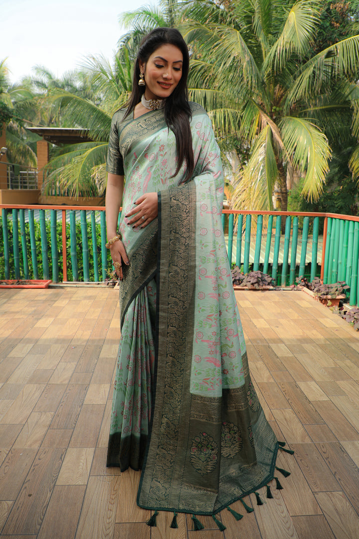 Gorgeous pista-green Kanjivaram soft silk saree with a heavy blouse, perfect for grand occasions and parties.