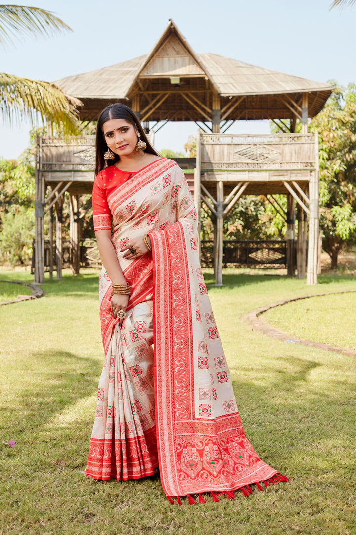 Pale-pink Traditional Kanjivaram soft silk saree with designer borders and delicate embroidery.