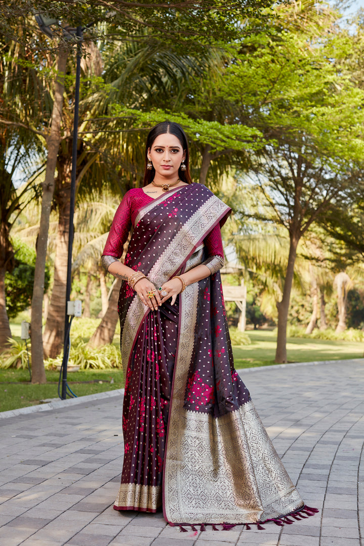 Beautiful wine Soft Satin Kanjivaram saree with fine butta detailing and a sparkling finish.