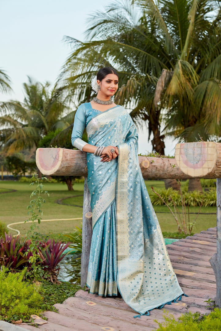 Stunning sky-blue Kanjivaram silk saree with intricate butta work and designer border, ideal for wedding events.