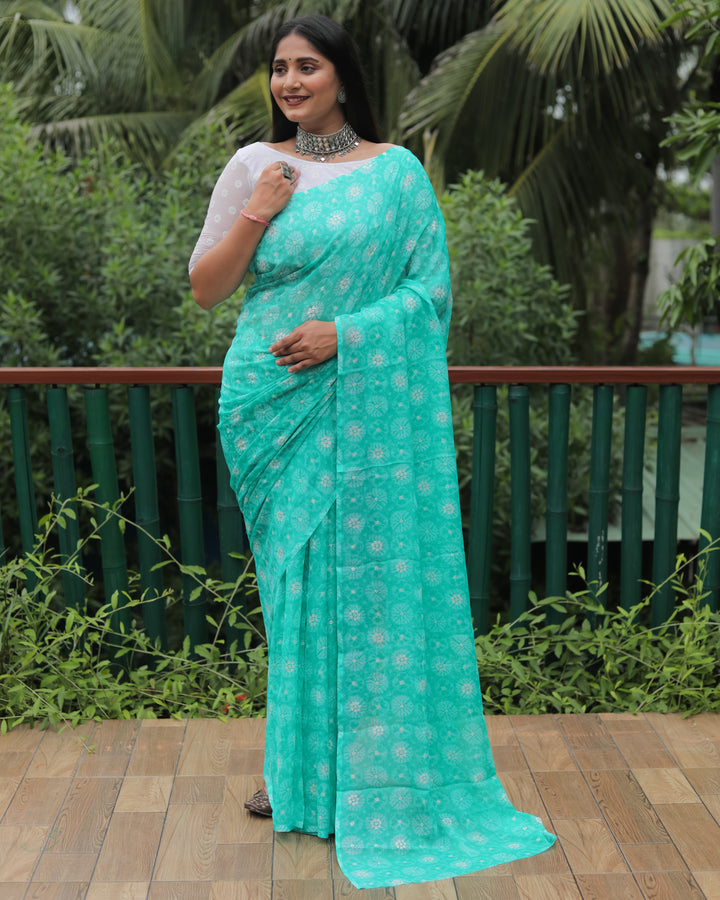 Graceful sea blue chiffon saree with intricate foil work, a stunning choice for celebrations.