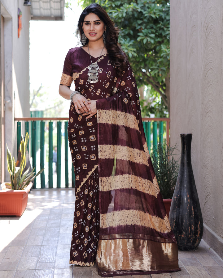 Elegant wine-colored Bandhej silk saree, featuring intricate traditional designs and a rich, vibrant tissue pallu.