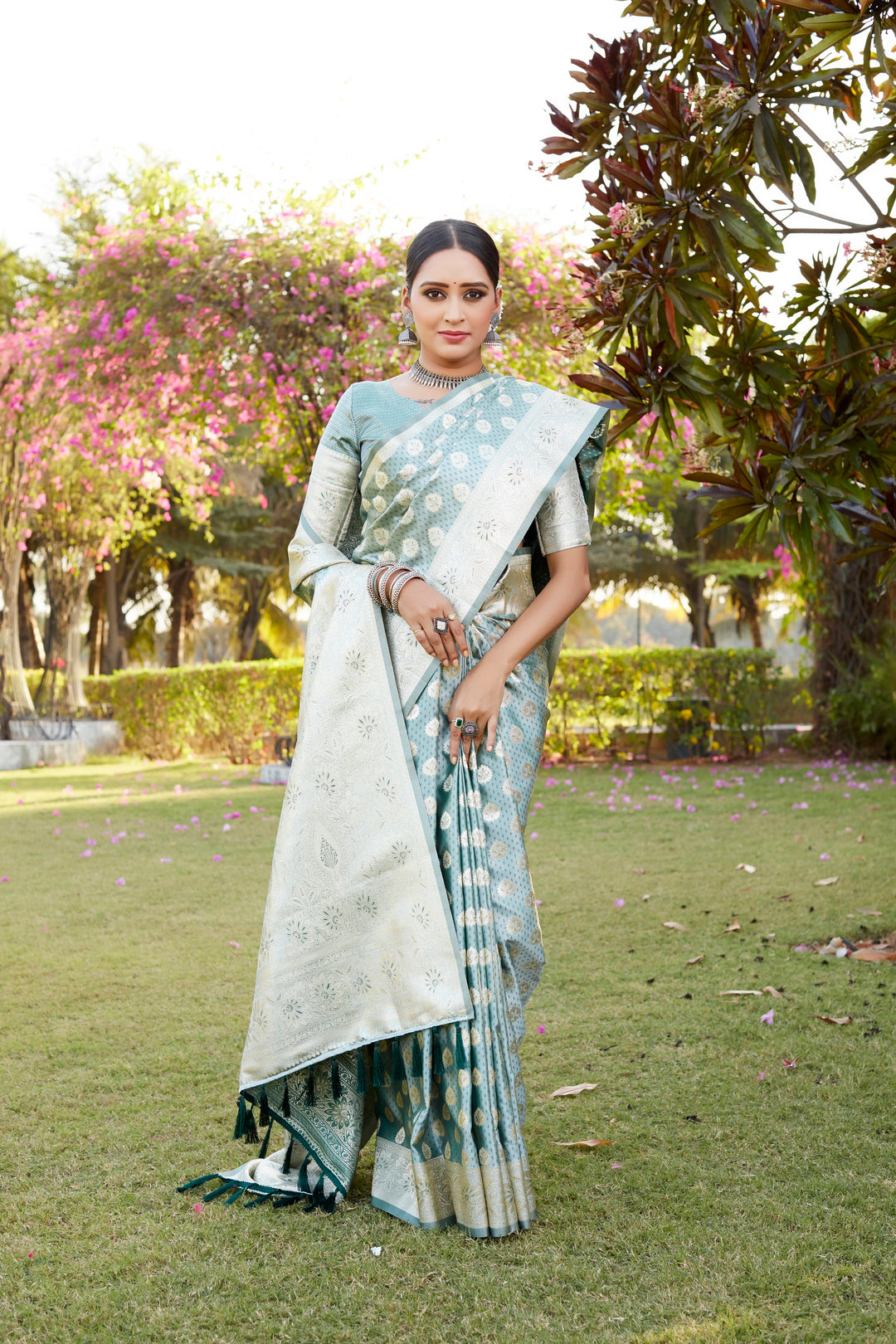 Stunning sky blue saree in Kanjivaram Soft Satin Silk, with intricate butta work and a shimmering satin finish for elegance.